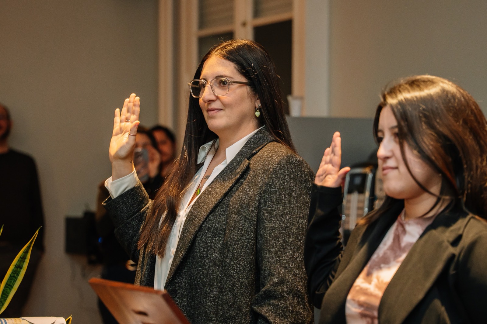 Emilia taking her oath as a sworn translator, right hand raised